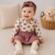 Conjunto Nicole Miller® 5 Piezas para Bebé Niña – Body Floral, Falda, Medias y Moño | 9 Meses