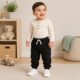 2026/04/734118.png Jogger French Terry Garanimals para bebé – Negro | 12 meses